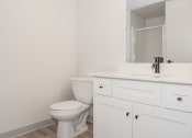 Thumbnail 18 of 42 - an empty bathroom with a toilet and a sink