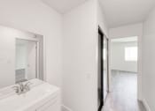Thumbnail 10 of 24 - a bathroom with a sink and a mirror
