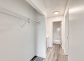 Thumbnail 7 of 24 - a bedroom with a medium sized closet and a bathroom in the background