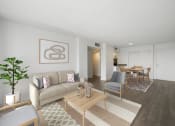 Thumbnail 8 of 33 - a living room with a couch and a table