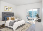 Thumbnail 4 of 42 - a bedroom with a bed and a door to a patio