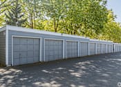 Thumbnail 18 of 48 - A long row of garage doors are closed.