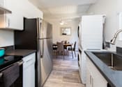 Thumbnail 26 of 29 - a kitchen and dining area in a 555 waverly unit