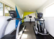 Thumbnail 18 of 29 - a room with two treadmills and two exercise bikes