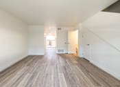 Thumbnail 8 of 29 - a bedroom with hardwood floors and white walls