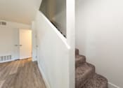 Thumbnail 7 of 29 - a view from the bottom of the stairs in a 555 waverly unit