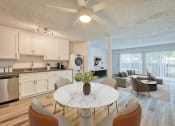 Thumbnail 2 of 15 - our apartments offer a living room with a kitchen and dining area