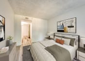 Thumbnail 9 of 15 - a bedroom with a large bed and two night stands with lamps