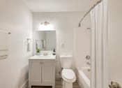Thumbnail 10 of 15 - a bathroom with a sink toilet and shower