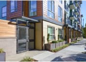 Thumbnail 19 of 23 - a row of apartment buildings on a city street