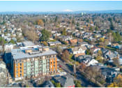 Thumbnail 2 of 23 - an aerial view of a city with a mountain in the background
