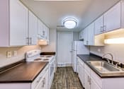 Thumbnail 27 of 31 - a kitchen with white cabinets and white appliances