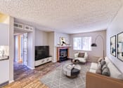 Thumbnail 19 of 31 - a living room with a fireplace and a tv