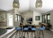 Thumbnail 5 of 22 - a room with a table and chairs and a tv on the wall