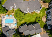 Thumbnail 21 of 22 - arial view of a house with a pool and yard