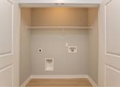 Thumbnail 21 of 24 - A small, empty room with a single shelf and two light switches.