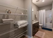 Thumbnail 16 of 38 - A bathroom with a shower, toilet, and sink.