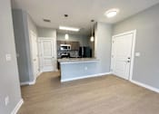 Thumbnail 20 of 38 - A kitchen area with a countertop and cabinets.