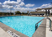 Thumbnail 27 of 38 - A swimming pool with a 5 ft depth marker.