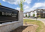 Thumbnail 30 of 38 - A sign that says Ridgeview Northgate in front of some houses.