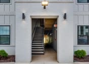 Thumbnail 14 of 15 - A light grey building with a sign that says UNITS 710 Montreat Way.