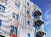 Thumbnail 61 of 74 - the facade of a modern apartment building with stairwells