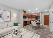 Thumbnail 3 of 74 - a living room with a white couch and a table with chairs