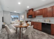 Thumbnail 4 of 74 - a kitchen and dining room with a table and chairs