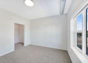 Thumbnail 16 of 74 - an empty room with two windows and a closet