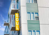 Thumbnail 56 of 74 - a sign on the side of a building