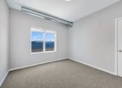 Thumbnail 17 of 74 - an empty room with carpet and a window