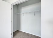 Thumbnail 24 of 74 - an empty closet in an empty room with white walls and a window
