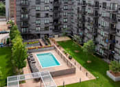 Thumbnail 11 of 73 - outdoor pool and green space