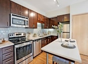Thumbnail 18 of 73 - Dark cabinets and stainless steel appliances