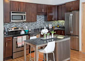 Thumbnail 29 of 73 - renovated apartment with glass tile backsplash