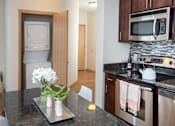 Thumbnail 30 of 73 - two bedroom kitchen with in-unit laundry