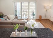Thumbnail 34 of 73 - living room with patio door and balcony