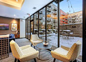 Thumbnail 50 of 73 - lounge overlooking patio and grilling stations with community herb and vegetable garden
