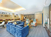 Thumbnail 51 of 73 - Community room with kitchen and coffee bar
