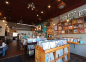 Thumbnail 61 of 61 - a bookstore with a bunch of books on the shelves