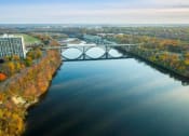 Thumbnail 50 of 61 - arial view of a river with a bridge in the background