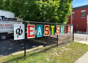 Thumbnail 43 of 61 - a fence with a sign on it that says eastside