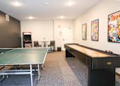 Thumbnail 17 of 21 - A room with a pool table and a ping pong table.