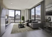 Thumbnail 1 of 24 - a living room with a couch and a coffee table in front of a window at Platform 4611, Chicago Illinois