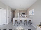 Thumbnail 5 of 24 - a kitchen with a large island with three stools in front of it at Platform 4611, Chicago, IL