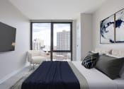 Thumbnail 4 of 24 - a bedroom with a large bed and a large window  at Platform 4611, Chicago, IL 60640