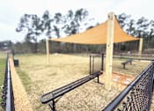 Thumbnail 20 of 22 - A baseball field with a canopy and benches.