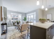 Thumbnail 12 of 28 - Open living room with a kitchen and a dining room at 101 Base Line Road West, London, Ontario