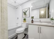 Thumbnail 16 of 16 - Bathroom with a toilet sink and bathtub at Platts Crossing, London, ON