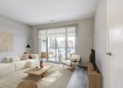 Thumbnail 22 of 28 - Living room with a white couch and a sliding glass door  at 101 Base Line Road West, London